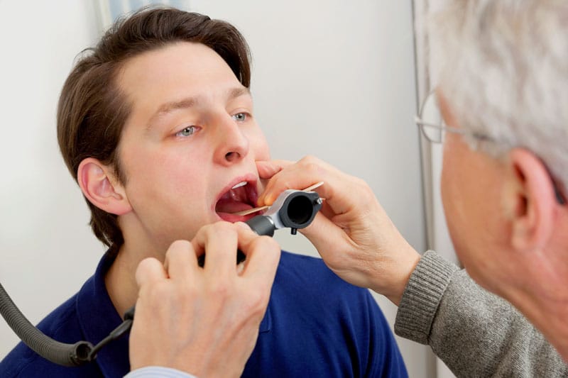 Man receiving an oral exam