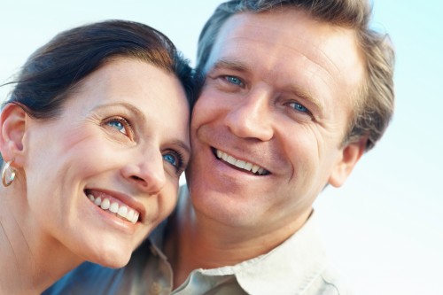 happy couple hearing aids portland