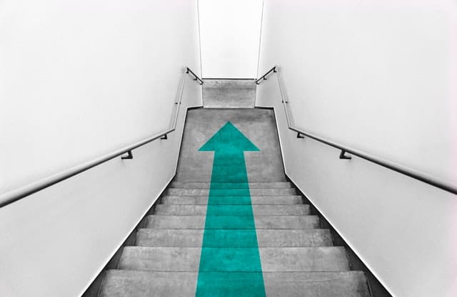 stairs with a downward facing arrow 