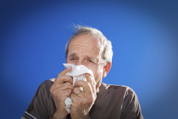 Person blowing nose