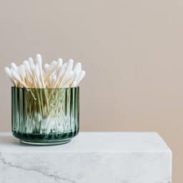 photo-of-white-cotton-buds-in-glass-container