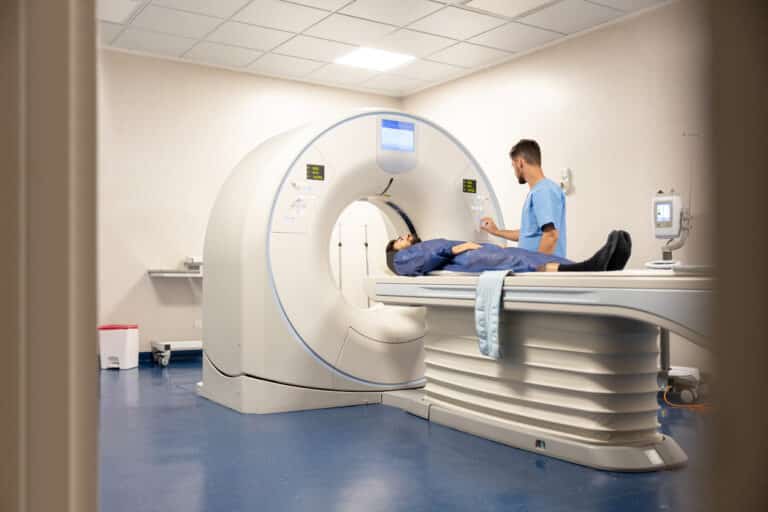 Man being moved into an MRI machine