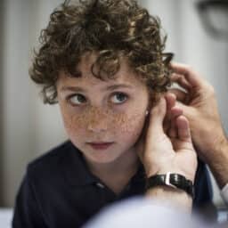 Young boy gets ear examined