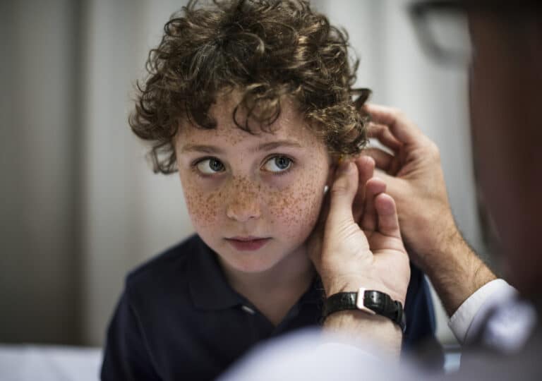 Young boy gets ear examined