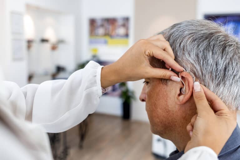 Man is fitted for hearing aids 