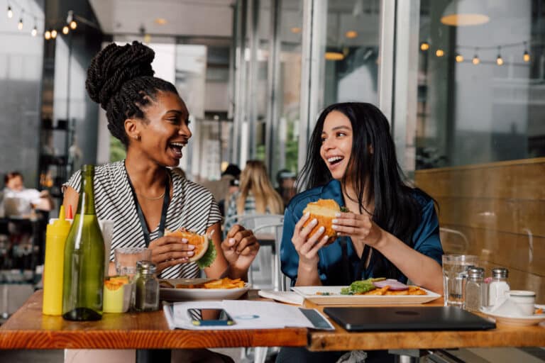Two women having a pleasant lunch together in a cafe