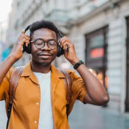 Enjoying music with over-ear headphones.
