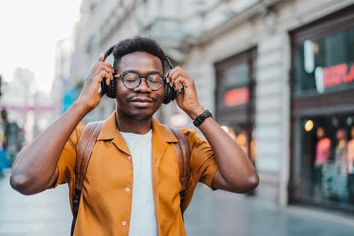 Enjoying music with over-ear headphones. Enjoying music with over-ear headphones.