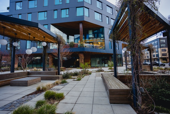 Green Office Buildings in Downtown Portland Office buildings in downtown Portland Oregon with a natural garden feature. Some of these buildings have rooftop gardens and plants growing in the skyline level.